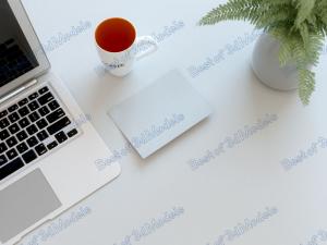 minimal desk with laptop and cup of coffee stock photo